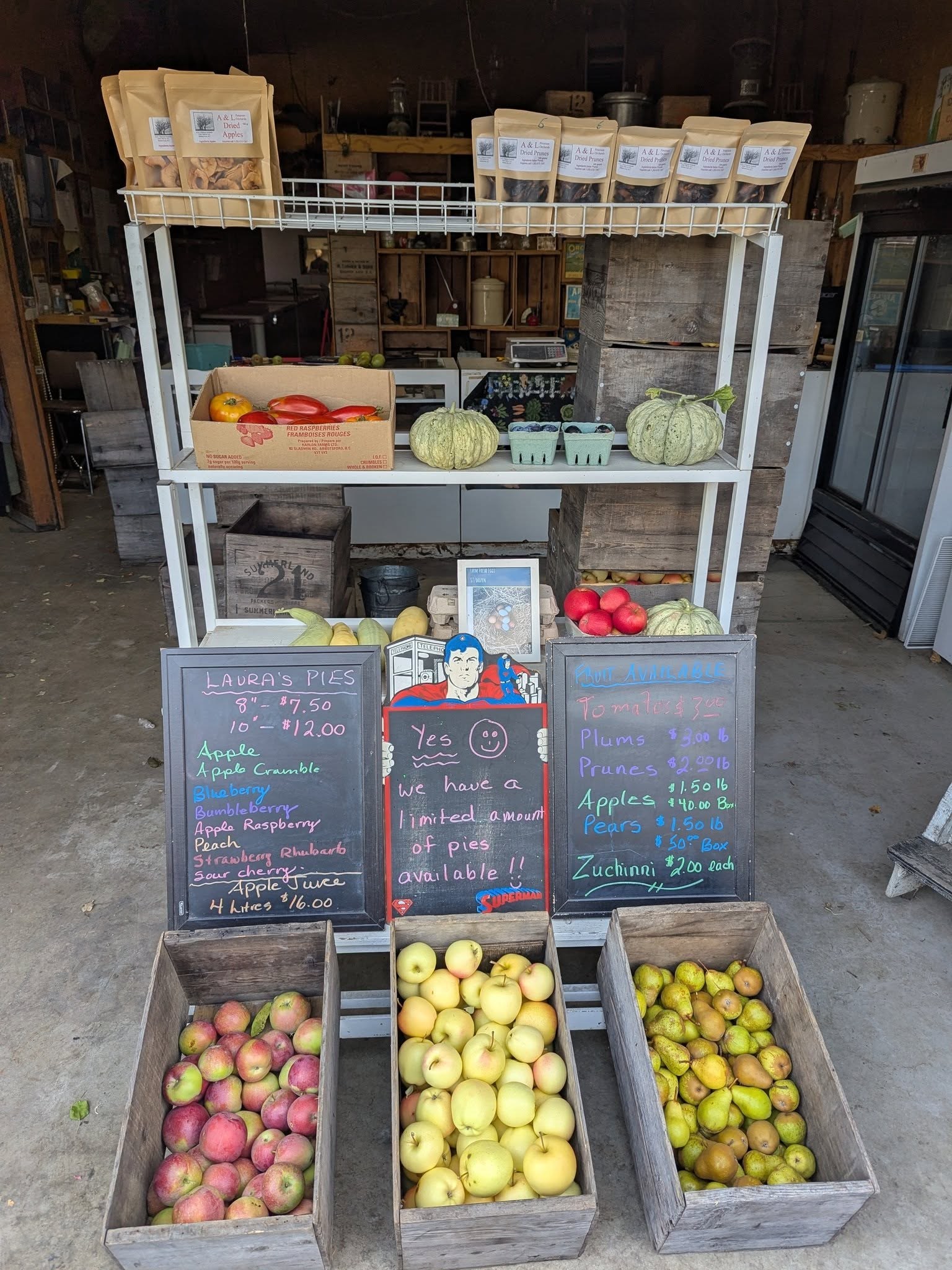 Peterson Orchard's roadside farm stand stacked with crates of fresh apples