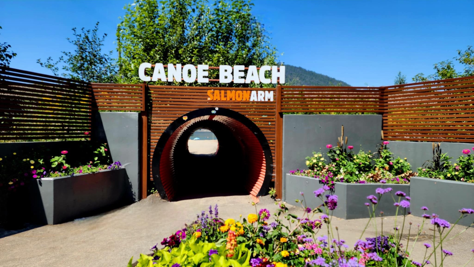 A quiet sandy stretch of Canoe Beach on the Shuswap